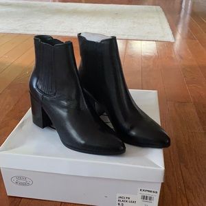 New and never worn black leather boots.